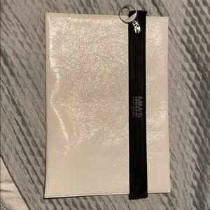 White with black zipper leather clutch